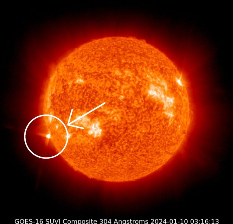 A red sun shows bright spots and a white circle and a white arrow pointing a bright spot.