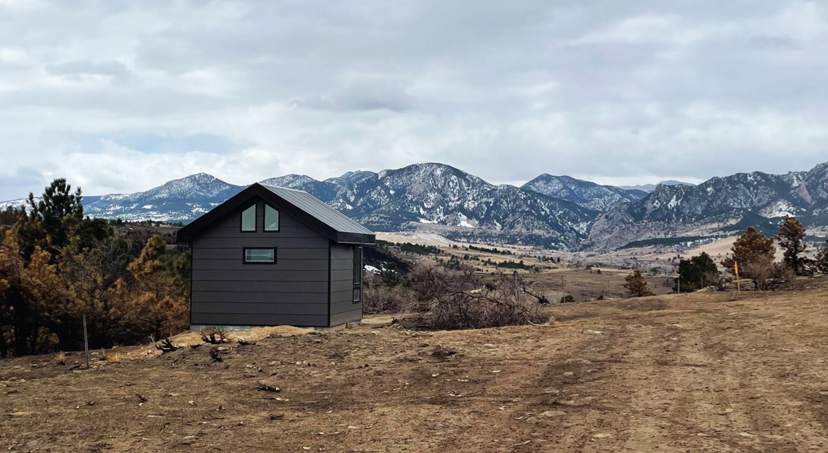 A Studio Shed installed in a Colorado location with the Rocky mountains in the background.