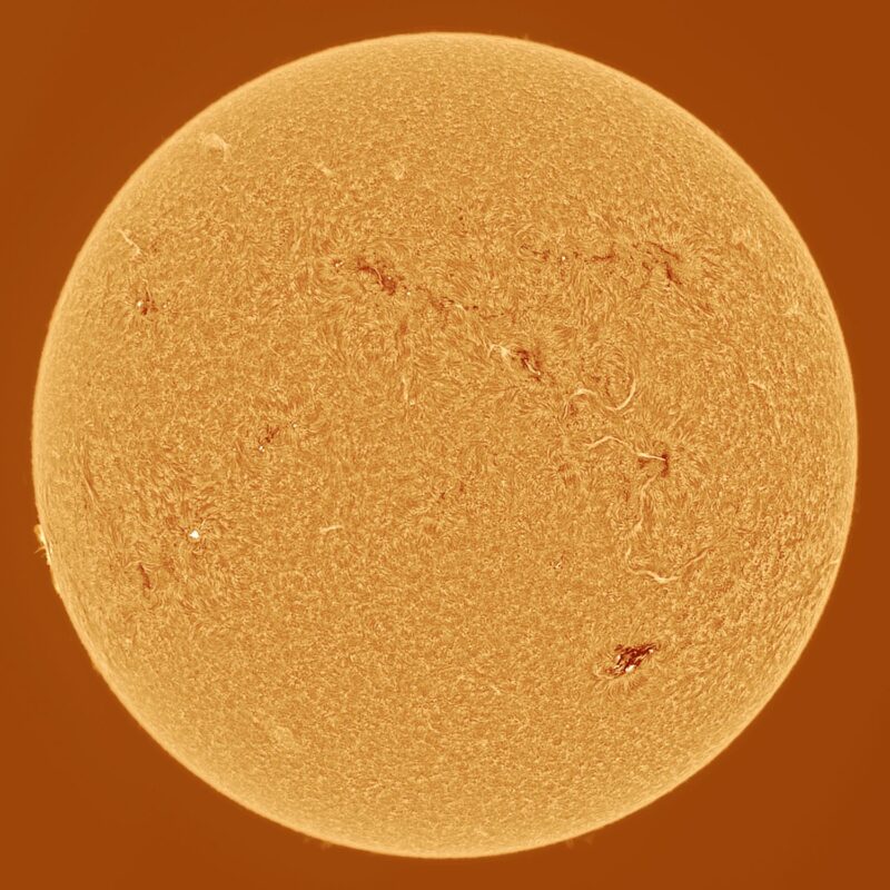 The sun, seen as a large yellow sphere with a mottled surface.