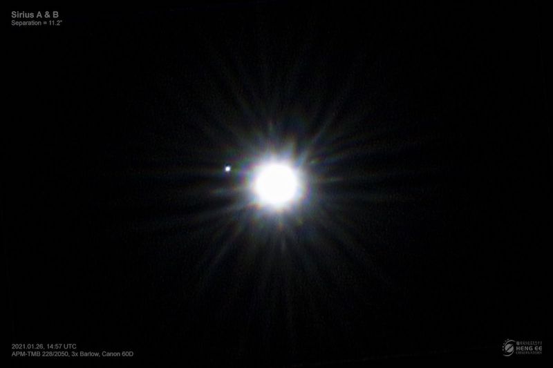 Sirius B: Black background with one central white spot with spikes, and a tiny white dot on its left side.