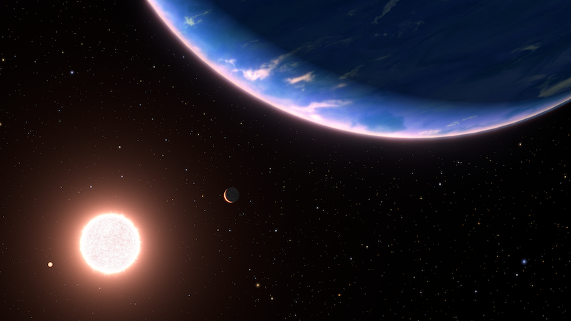 Smallest exoplanet yet with water vapor: Close blue planet with small white clouds, with a tiny crescent planet and big bright star in the distance.