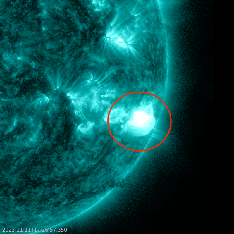 The bottom right quarter of a teal globe with a bright patch circled in red. 