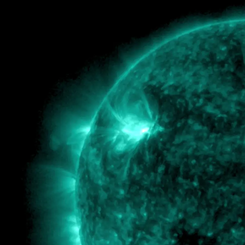 Sun news: The sun in a bluish light with a bright burst at the upper left.